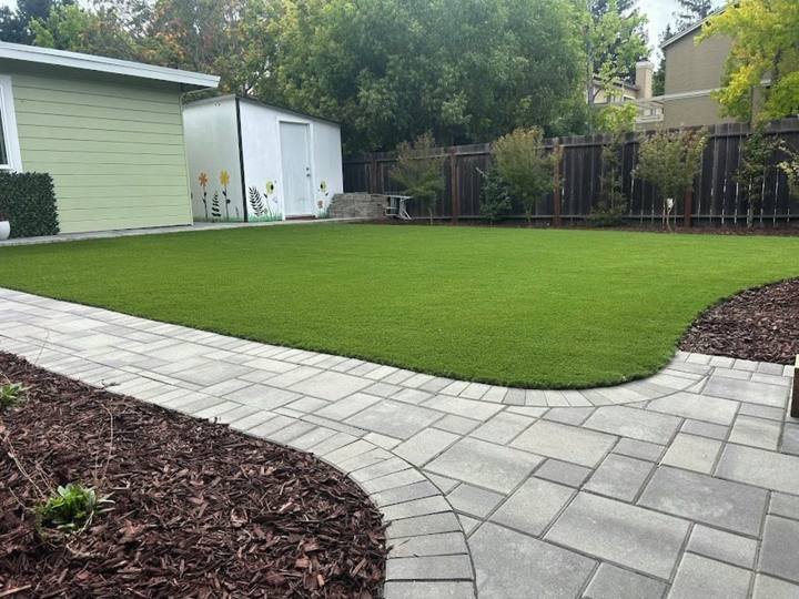 New lawn with curved paver path by DG Landscape Design